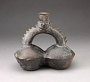 Double-Chambered Vessel with Serrated Stirrup Spout in Form of Human Head by Chimú