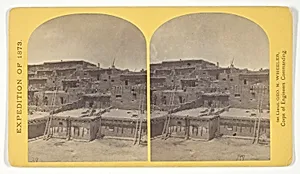 Indian Pueblo of Zuni, New Mexico; view from the interior. The "Pueblo" or town, encloses a quadrangular area within which are the ruins of a church built under the direction of the Jesuit missionaries. The houses are built one above the other to the height of five or six stories. The entrances are mostly from the top, the ascent and descent being made by ladders, No. 16 from the series "Geographical Explorations and Surveys West of the 100th Meridian"