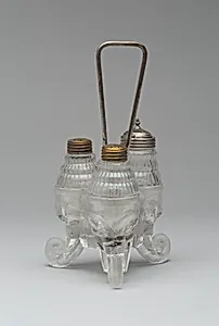 "Jumbo"/Elephant pattern cruet stand with three bottles