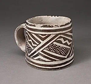 Mug with Interlocking Geometric Pattern with Zigzag Motifs and Crosshatching