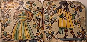 Polychrome Tiles Depicting Male and Female Figures in Contemporary Dress Surrounded by Abstract Foliage