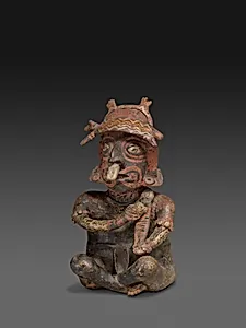 Seated Figure Playing a Rasp