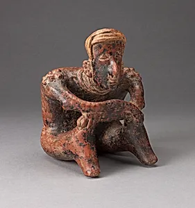 Seated Male Figure Leaning Forward with Arms Crossed over Knees