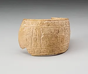 Shell, Possibly an Arm Band, Incised with Profile Head Framed by Geometric Motifs (Fragment)