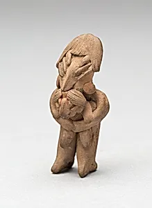 Standing Female Holding a Child in Her Arms
