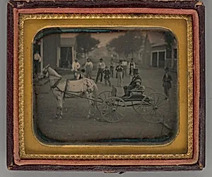 Untitled (Man with Top Hat and Boy atop Horse-Drawn Carriage) by Unknown