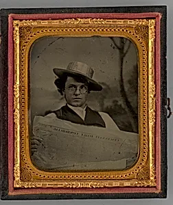Untitled (Portrait of a Man Holding a Newspaper and Wearing a Straw Hat) by Unknown Maker