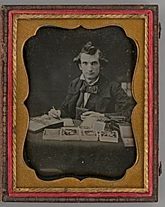 Untitled (Portrait of Seated Man Holding a Daguerreotype and Brush)