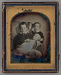 Untitled (Two Boys Holding a Deceased Baby) by Unknown
