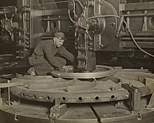 Worker at Grinding Machine