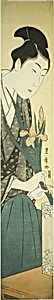 Young man arranging irises in a vase