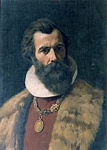 Bärtiger Mann mit Pelzkragen und Kette