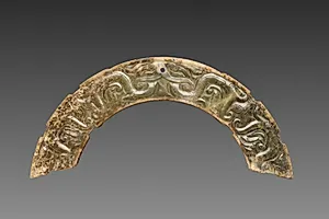 Arc-shaped Pendant with Animal Mask and Interlaced Animal Bands (Huang) by Unknown Artist