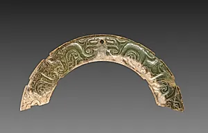 Arc-shaped Pendant with Animal Mask and Interlaced Animal Bands (Huang) by Unknown Artist