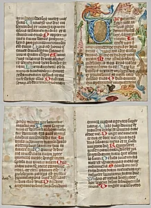 Bifolio from a Book of Hours: Initial V with Floral Border (recto); Text (verso) by Unknown Artist