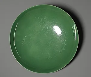 Dish with Green Glaze and Carved Floral Designs by Unknown Artist