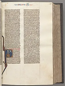 Fol. 86r, Judges, historiated initial R, Judah seated with a book talking to God by Unknown Artist
