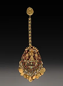 Forehead Pendant with Sun God Surya in a Chariot with Attendants by Unknown Artist