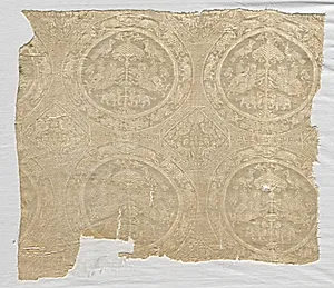 Fragment with confronted animal medallions and kufic bands by Unknown Artist