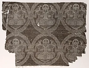 Fragment with seated prince holding falcons in kufic medallions by Unknown Artist