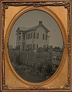 Homestead with picket fence and flowers by Unknown Artist