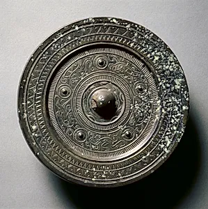 Mirror with Concentric Circles, an Immortal, and Auspicious Animals by Unknown Artist