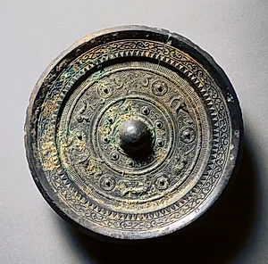 Mirror with Concentric Circles, an Immortal, and Auspicious Animals by Unknown Artist