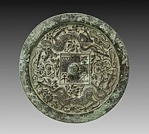 Mirror with Twin Dragons and Lotus Blossoms by Unknown Artist