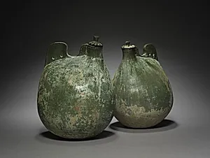 Pair of Leather Bag-Shaped Flasks with Covers by Unknown Artist