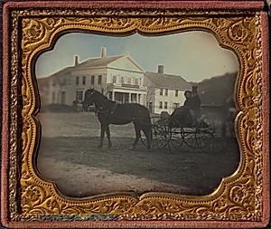 Solomon Clark Spelman and Martha W. Spelman in front of S.C. Spelman General Store, Hampden, MA by Unknown Artist
