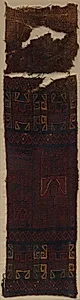 Textile Fragment with Frontal Deity Heads, Felines, and Interlace Pattern by Unknown Artist