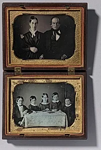The Homework Table & Parents of Five Children Doing Homework by Unknown Artist