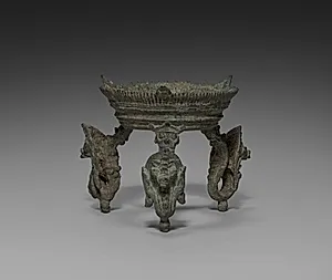 Tripod stand with nagas for a ritual conch shell by Unknown Artist