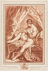 Young Woman Seated on a Bed