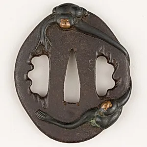 Sword Guard (<i>Tsuba</i>) Depicting Two Gibbons (二疋手長猿図鐔)