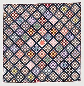 Thirteen-patch block quilt with Japanesque backing fabric by Unknown