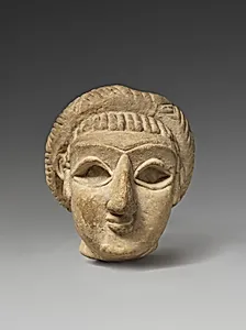 Female head with elaborate hairstyle