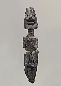 Furniture leg (?) with a recumbent lion supporting a deity