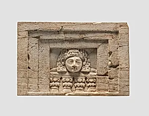 Furniture plaque carved in relief with a “woman at the window”