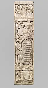 Furniture plaque carved in relief with warrior holding lotuses