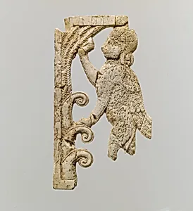 Openwork plaque with a sphinx at a tree