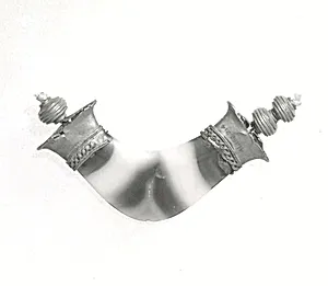 Part of a necklace: pendant and beads