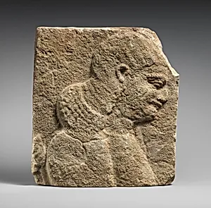 Relief: head and shoulders of a beardless man, possibly a eunuch
