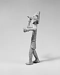 Smiting weather god or warrior with horned headgear