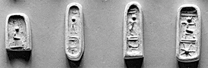 Stamp seal (in the shape of a foot, with loop handle) with deities (?) and anthropomorphic figures
