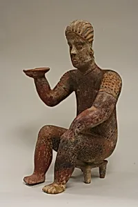 Female Figure Seated on Stool