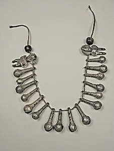 Necklace with bells and two figures