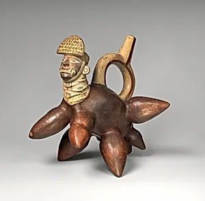 Stirrup-spout bottle with manioc form