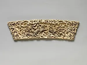 Plaque with dragon, pheasant, quail, and other birds amidst bamboo and plum blossom