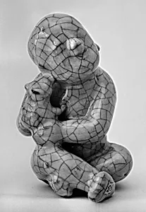 Figure of a seated boy